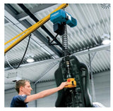 Demag DCM-Pro Manulift hoist for material handling lifting a large industrial object with operator control