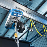 Gorbel electric chain hoist 1 phase mounted on overhead rail for heavy lifting in an industrial setting
